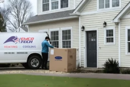 AC replacement in Horsham PA — EMCO Tech technician installing new air conditioner