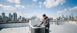 Commercial rooftop AC unit being inspected for problems in Philadelphia, PA