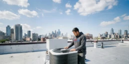 Commercial rooftop AC unit being inspected for problems in Philadelphia, PA