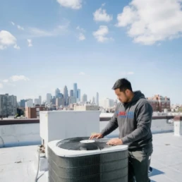 Commercial rooftop AC unit being inspected for problems in Philadelphia, PA