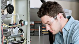 Fixing Your Furnace Before it Completely Malfunctions - EMCO Tech Heating & Cooling Technician Repairs Furnace
