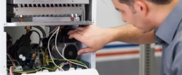 Is It Time for a New Heating System - EMCO Tech Technician Repairing Heater in Philadelphia