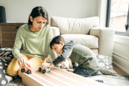 4 Things To Know Before Turning Your Air Conditioner Back On - family at home playing