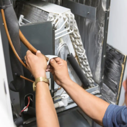 EMCO Tech Heating Contractors in Willow Grove PA - Technician Working on Evaporator Coil