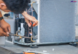 HVAC Technician Repairing Freon Lines on Air Conditioning System in Lansdale