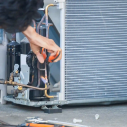 HVAC Technician Repairing Freon Lines on Air Conditioning System in Lansdale