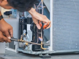 HVAC Technician Repairing Freon Lines on Air Conditioning System EMCO Tech HVAC Services in Lansdale