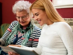 Happy Customer Looking at Family Pictures in West Chester PA - EMCO Tech