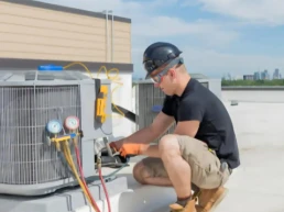 Commercial HVAC Services in Doylestown PA - Technician from EMCO Tech Servicing AC unit on the roof