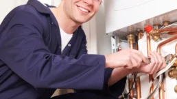 Reliable HVAC Services in Doylestown PA - EMCO Tech Technician repairs high efficiency boiler