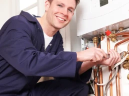 Reliable HVAC Services in Doylestown PA - EMCO Tech Technician repairs high efficiency boiler
