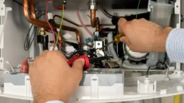 Tankless Boiler Services in Philadelphia - EMCO Tech Plumber is Working with High Efficiency Tankless Boiler Repairs