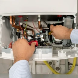 Tankless Boiler Services in Philadelphia - EMCO Tech Plumber is Working with High Efficiency Tankless Boiler Repairs