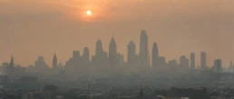 Wildfire smoke haze over the Philadelphia skyline affecting indoor air quality