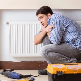 Heating Repair Services in Villanova, PA by EMCO Tech - Customer is Trying to Repair Boiler Radiator Himself