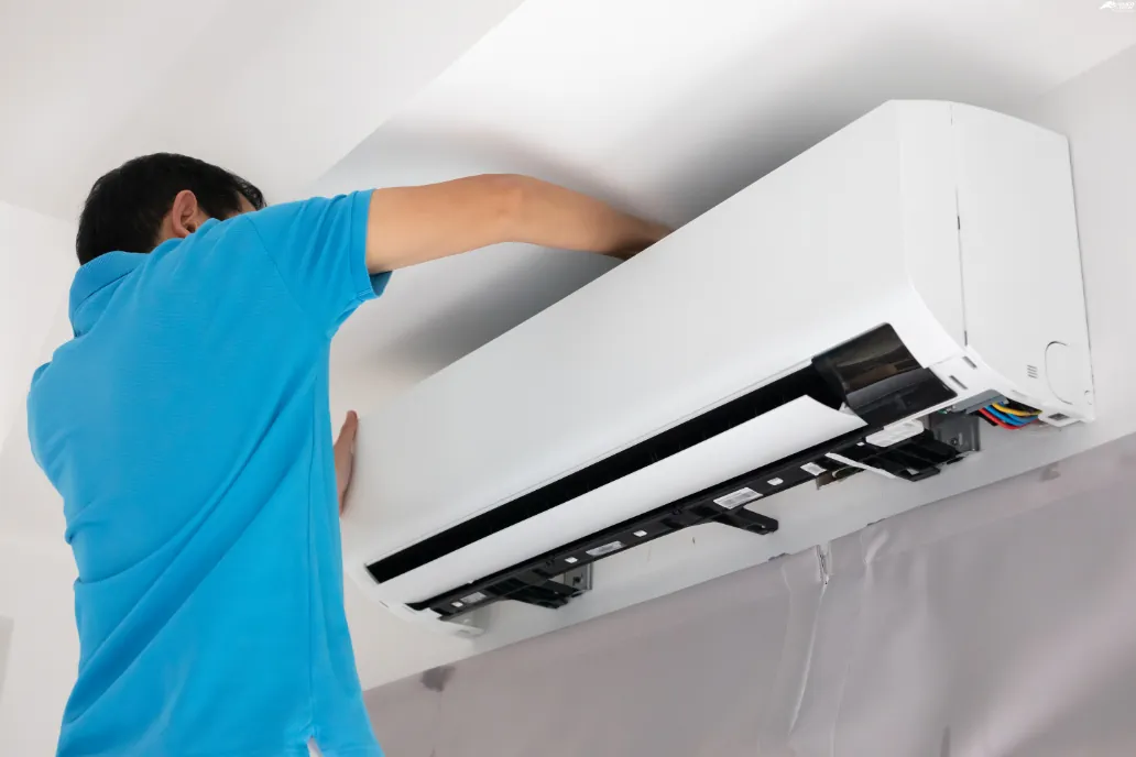 Technician Cleaning Mini Split System