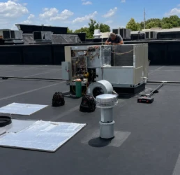EMCO Tech Technician Checking Commercial Rooftop HVAC Unit in North Wales PA